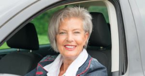 Mature women in her car