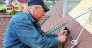 Roofing contractor working on a roof
