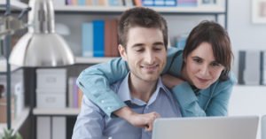 Young Couple shopping for insurance online